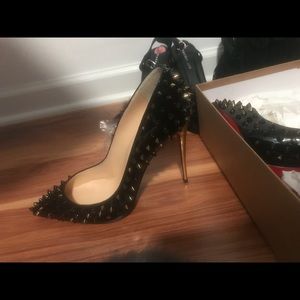 Christian Louboutin Black and gold with spikes